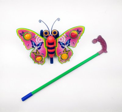 Дитяча каталка на паличці Метелик 305 махає крилами 305(Pink) фото